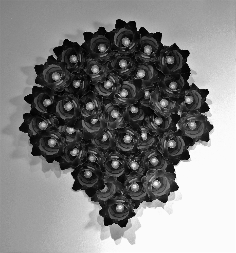 Bouquet of Lights, 2013-14
                    <br>Hand-cut and -assembled 3-D Silver Gelatin Photo Collage
                    <br>20¾ x 18⅝ x 3 inches